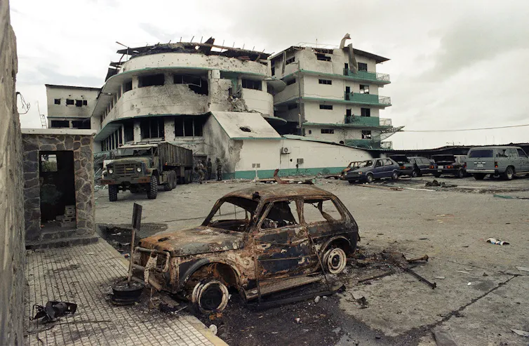 A photo of a bombed out vehicle.