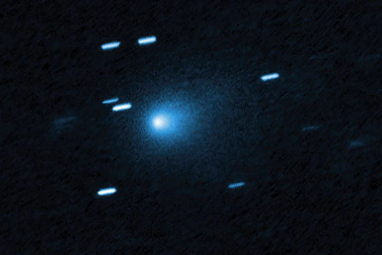 Shiny blue lights against a black void