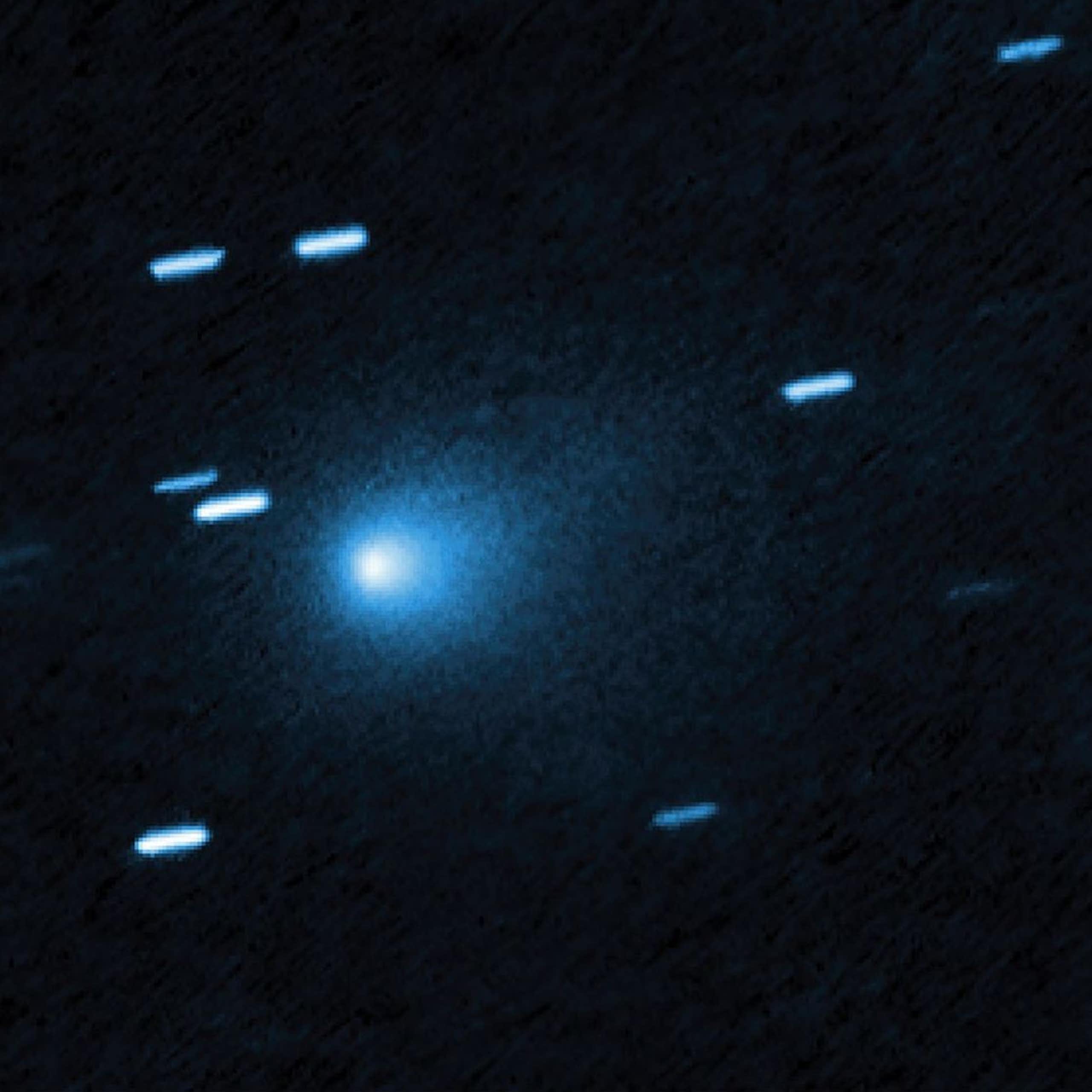 Shiny blue lights against a black void