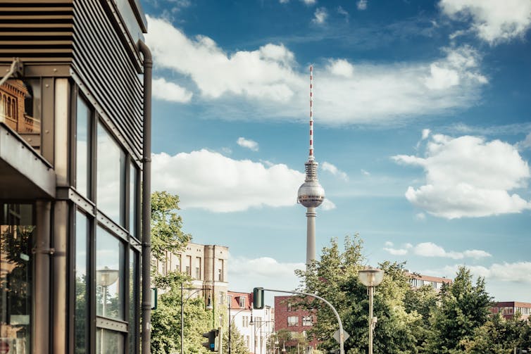 apartment blocks in berlin with the tv tower in the background