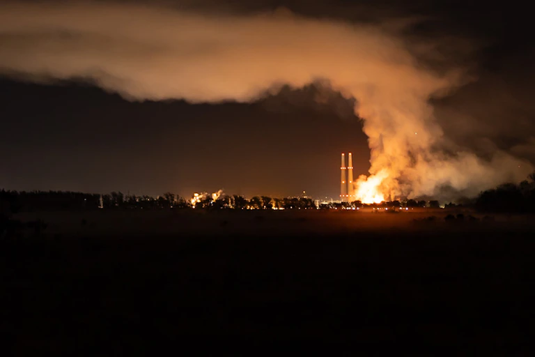A view across the bay to the battery plant fire and it's smoke plume.