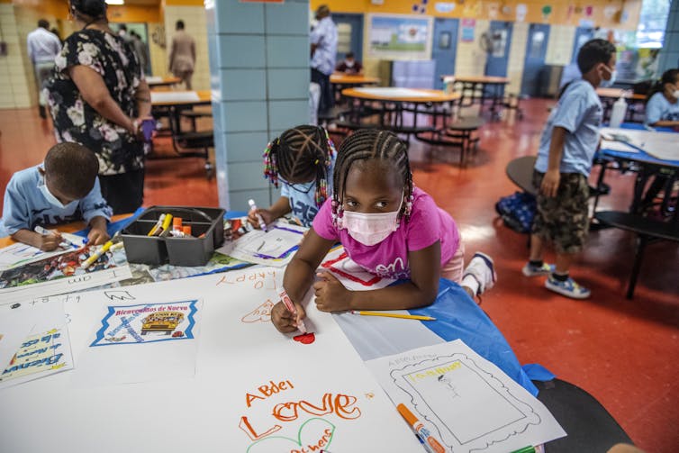 Nervousness over college admissions isn’t restricted to school – oldsters of small children also are feeling power, some extra acutely than others 1 A group of young children wearing face masks sit at a table and color on white paper.