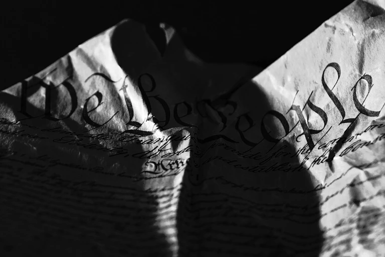 The US Constitution, torn in half from the top to bottom.
