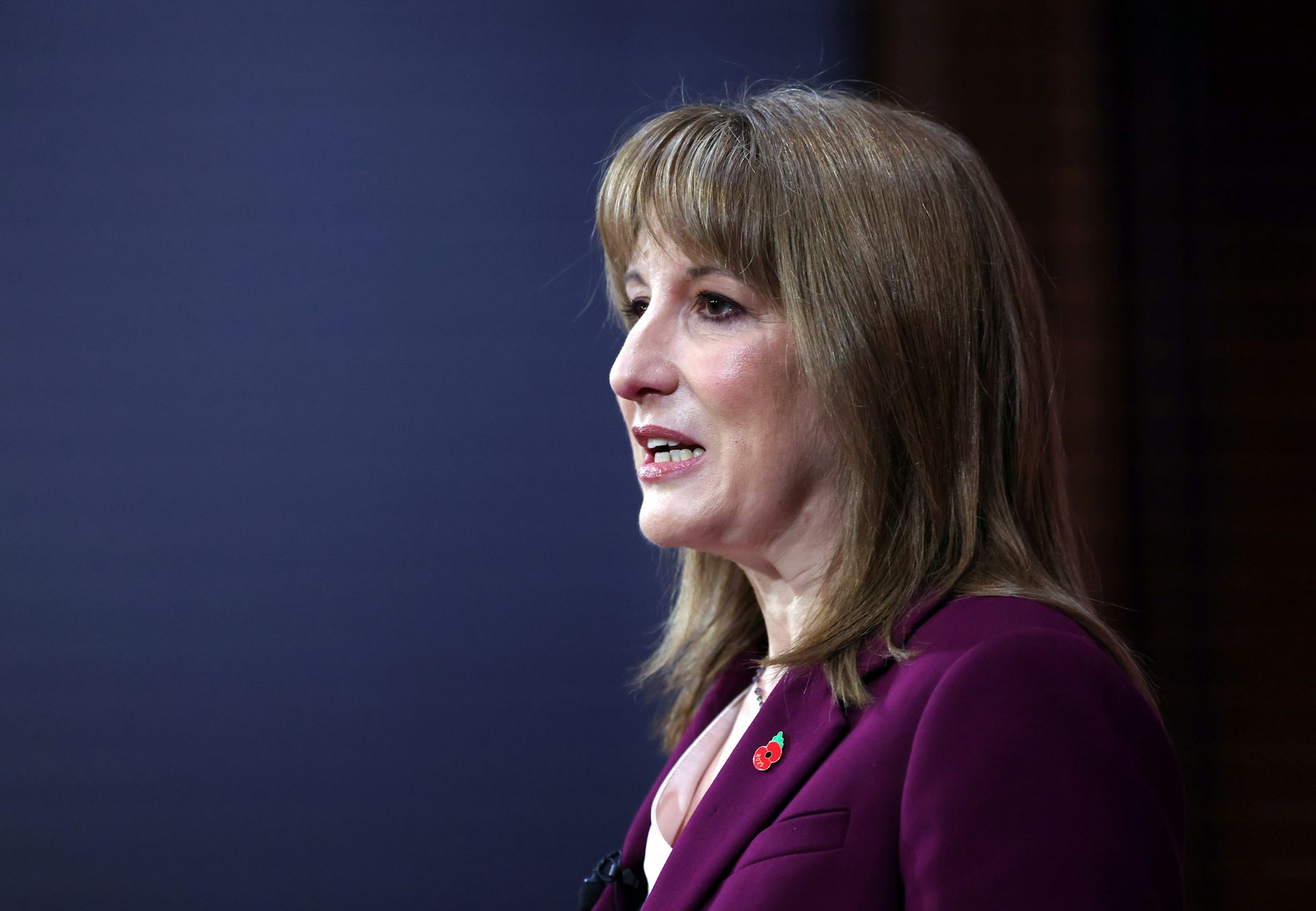 uk chancellor rachel reeves delivering a speech at downing street.