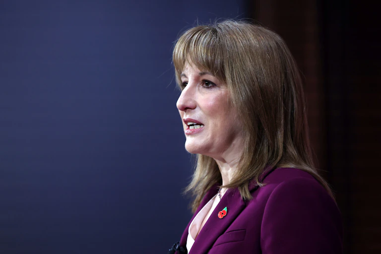 uk chancellor rachel reeves delivering a speech at downing street.