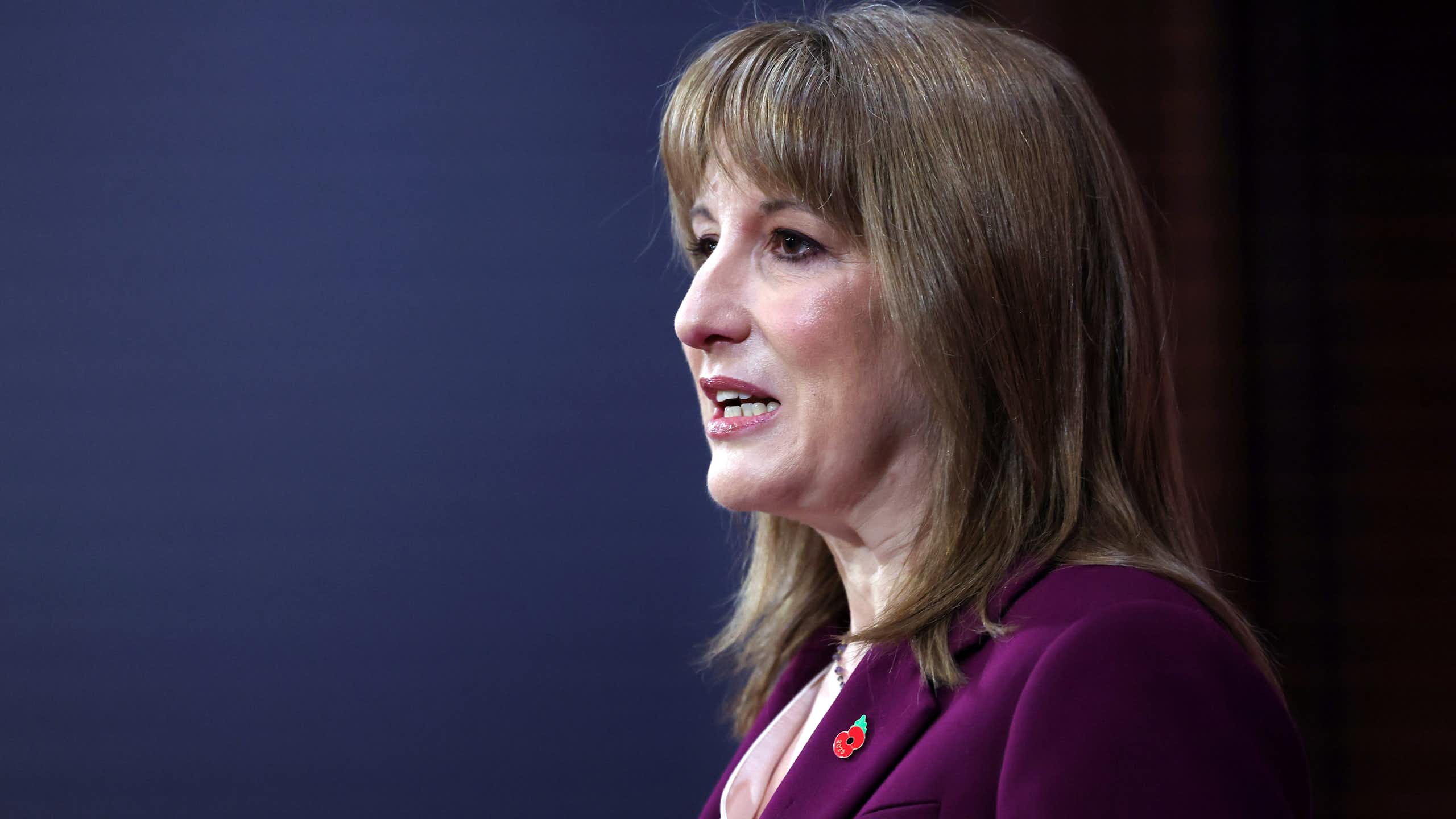 uk chancellor rachel reeves delivering a speech at downing street.