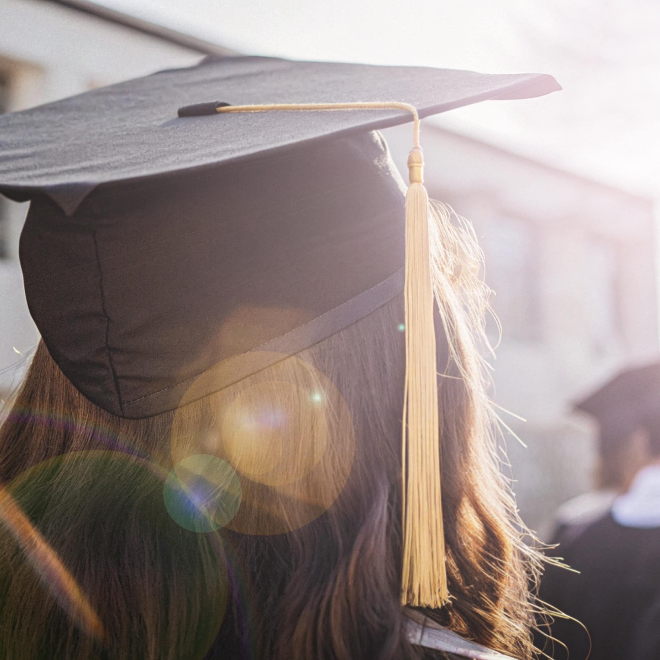 Graduate in moartarboard viewed from back