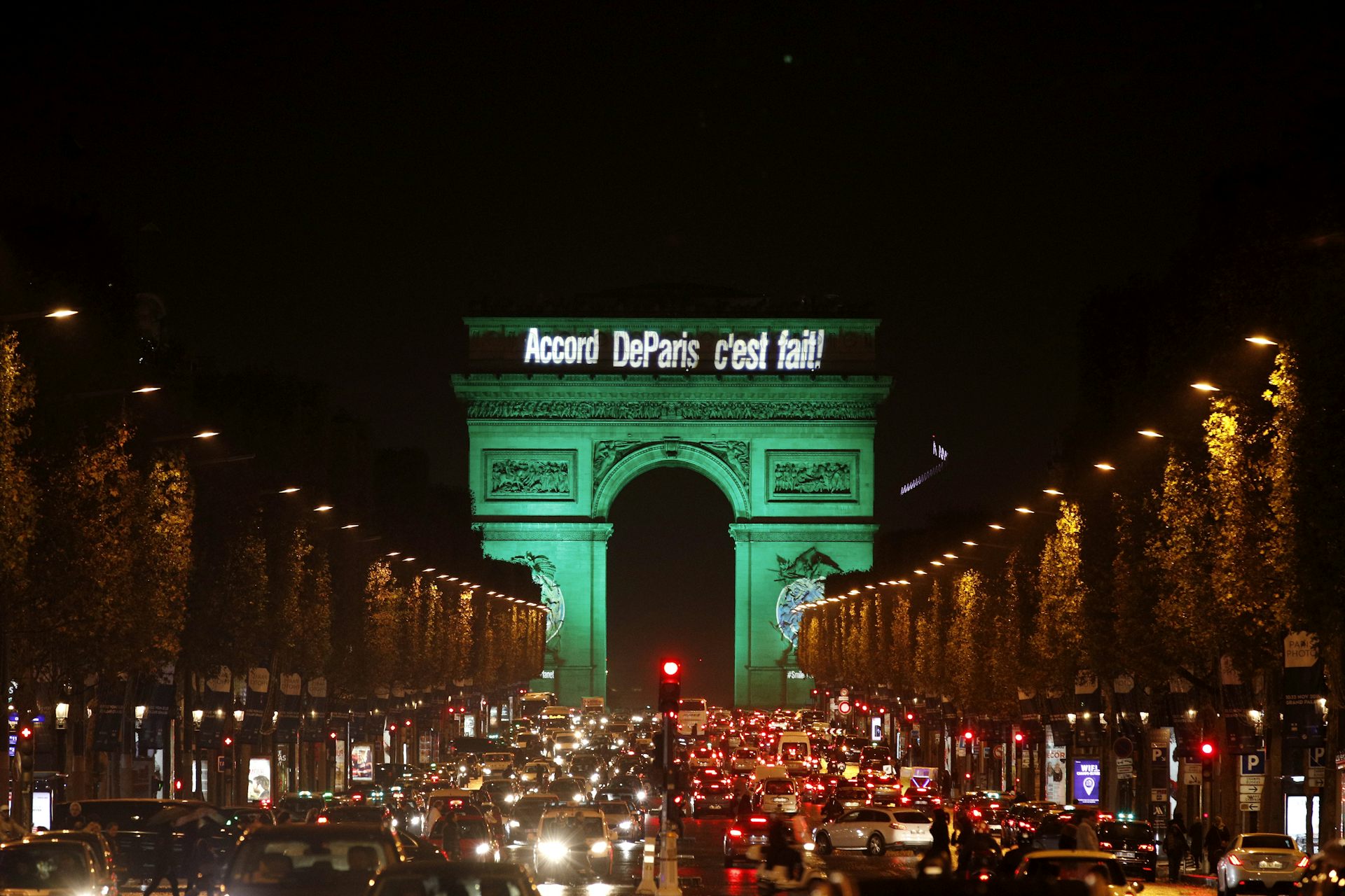 The Arc de Triomphe illuminated in green