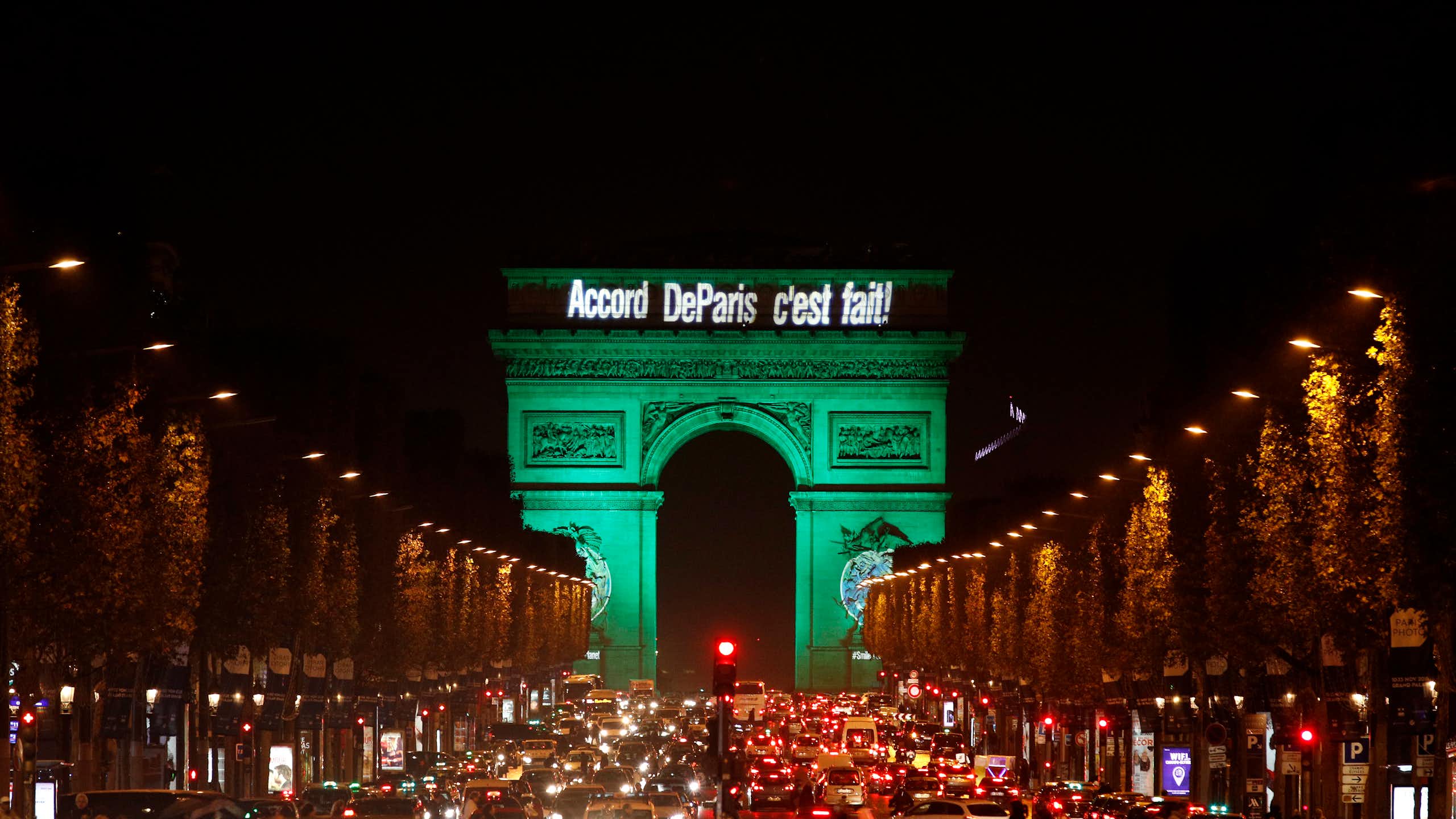 The Arc de Triomphe illuminated in green