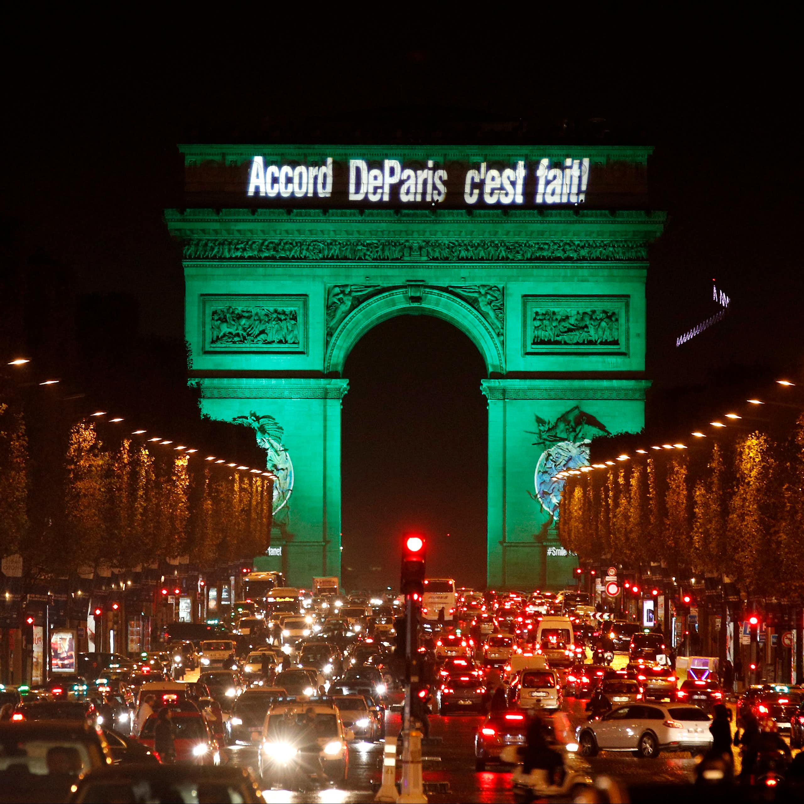 The Arc de Triomphe illuminated in green
