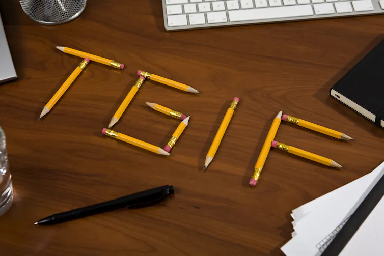 Pencils on a desk spell out TGIF, an abbreviation of thank God it's Friday.