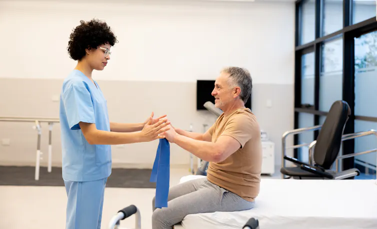Physio works with patient in a clinic
