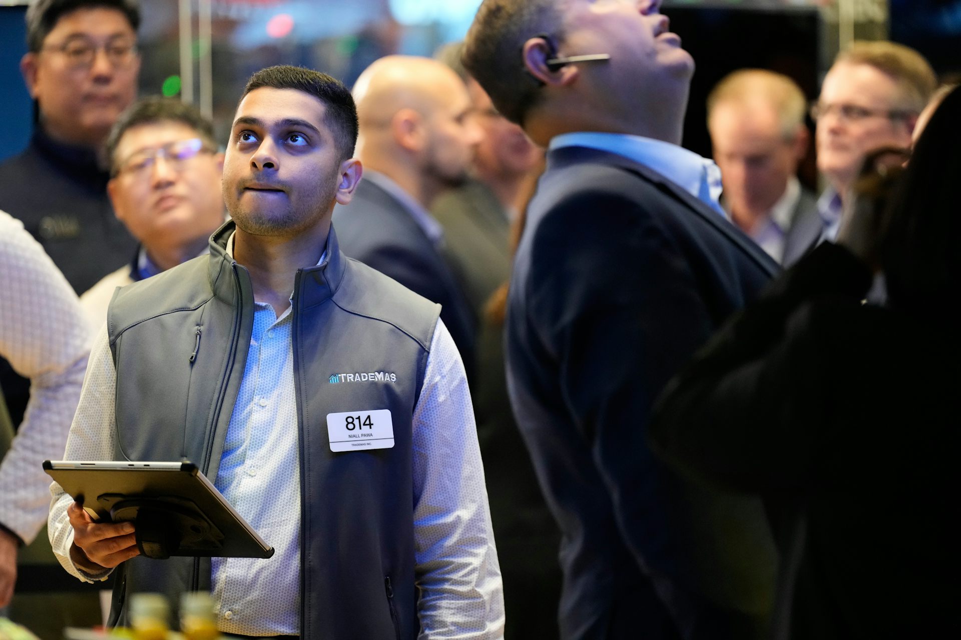 People working on the floor at the New York Stock Exchange