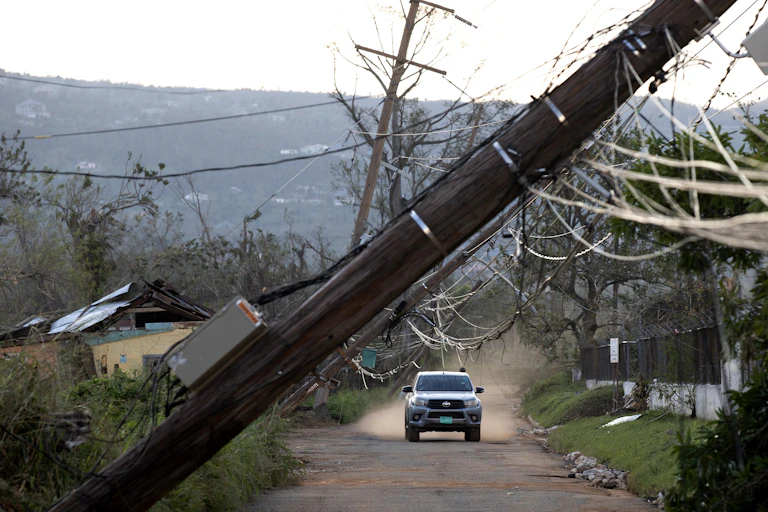 A road is blocked by falli g rubble in the aftermath of Hurricane Melissa in Jamaica, October 2025.