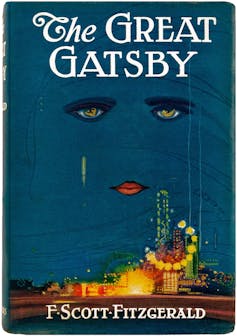 The original cover of The Great Gatsby showing a pair of green eyes and a red mouth hovering in the sky over a large house.