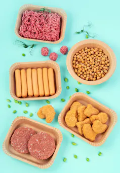 flatlay on blue of plant based meat alternative products