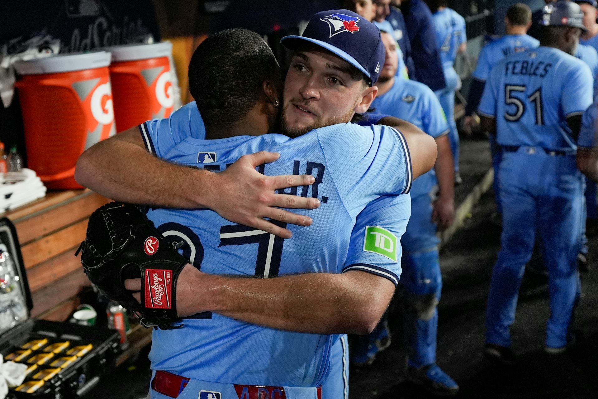 Two baseball players hugging
