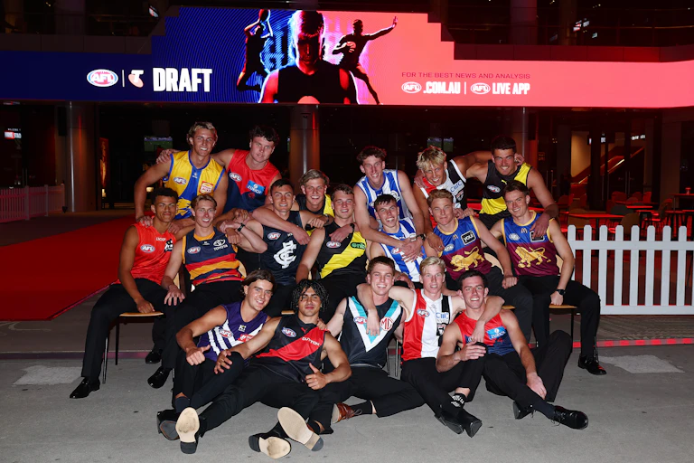 Players from the 2024 AFL draft celebrate after being drafted.