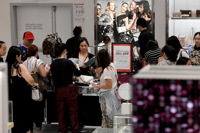 Shoppers are seen lining up to check out during Boxing Day sales in Sydney