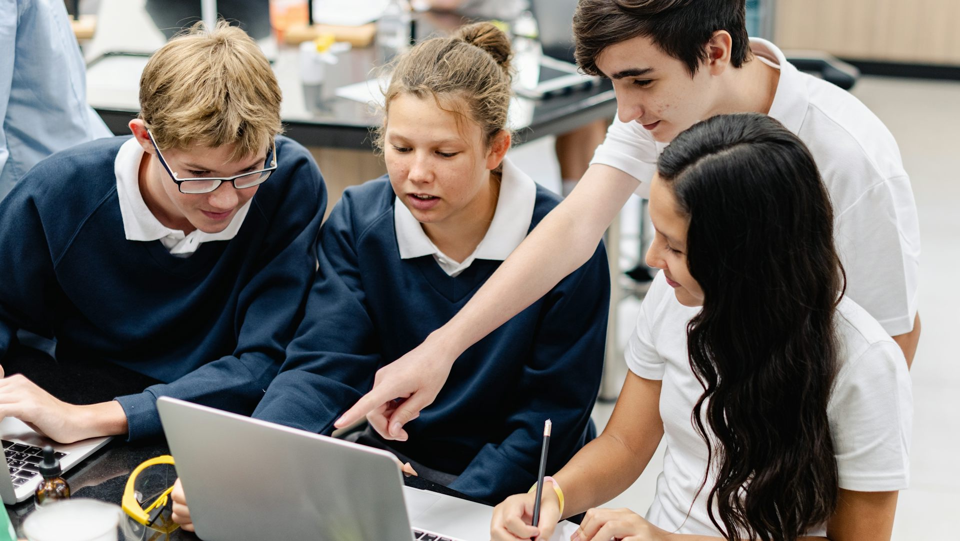 Pupils looking at laptop