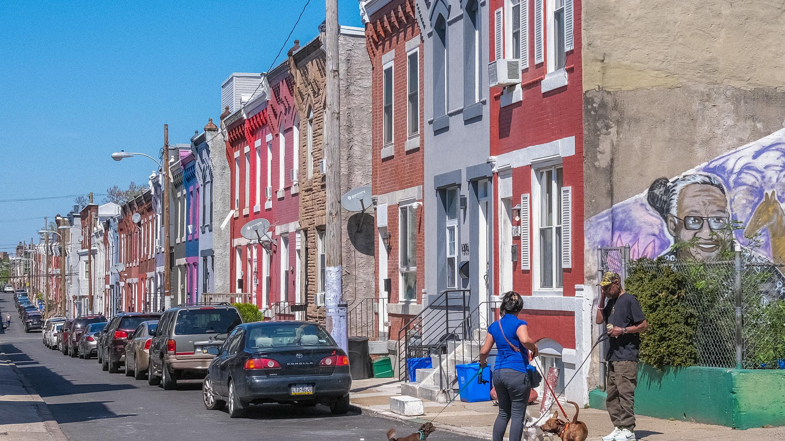 Colorful block of rowhomes on residential street