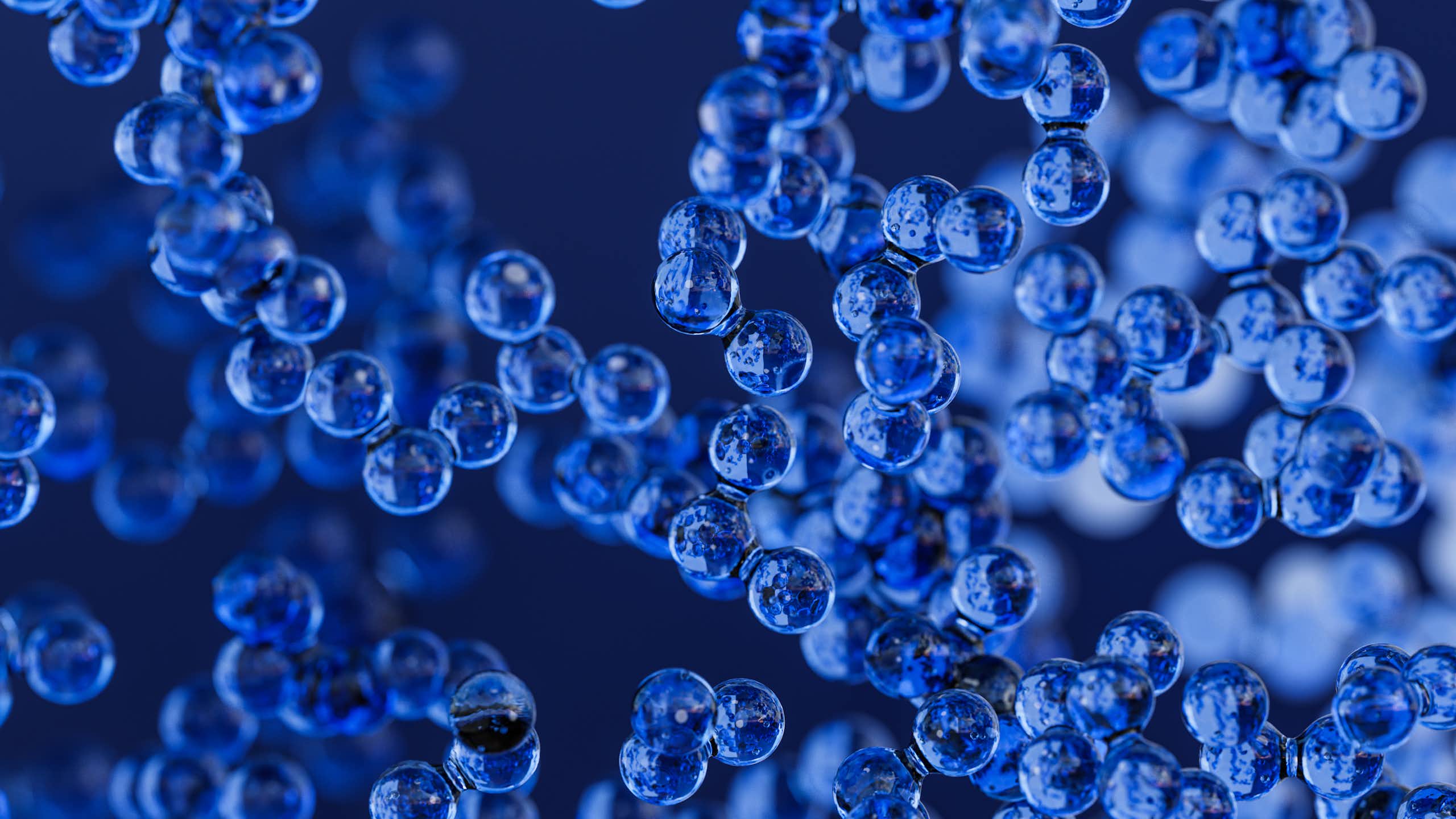 An illustration of small blue spheres clustered together.