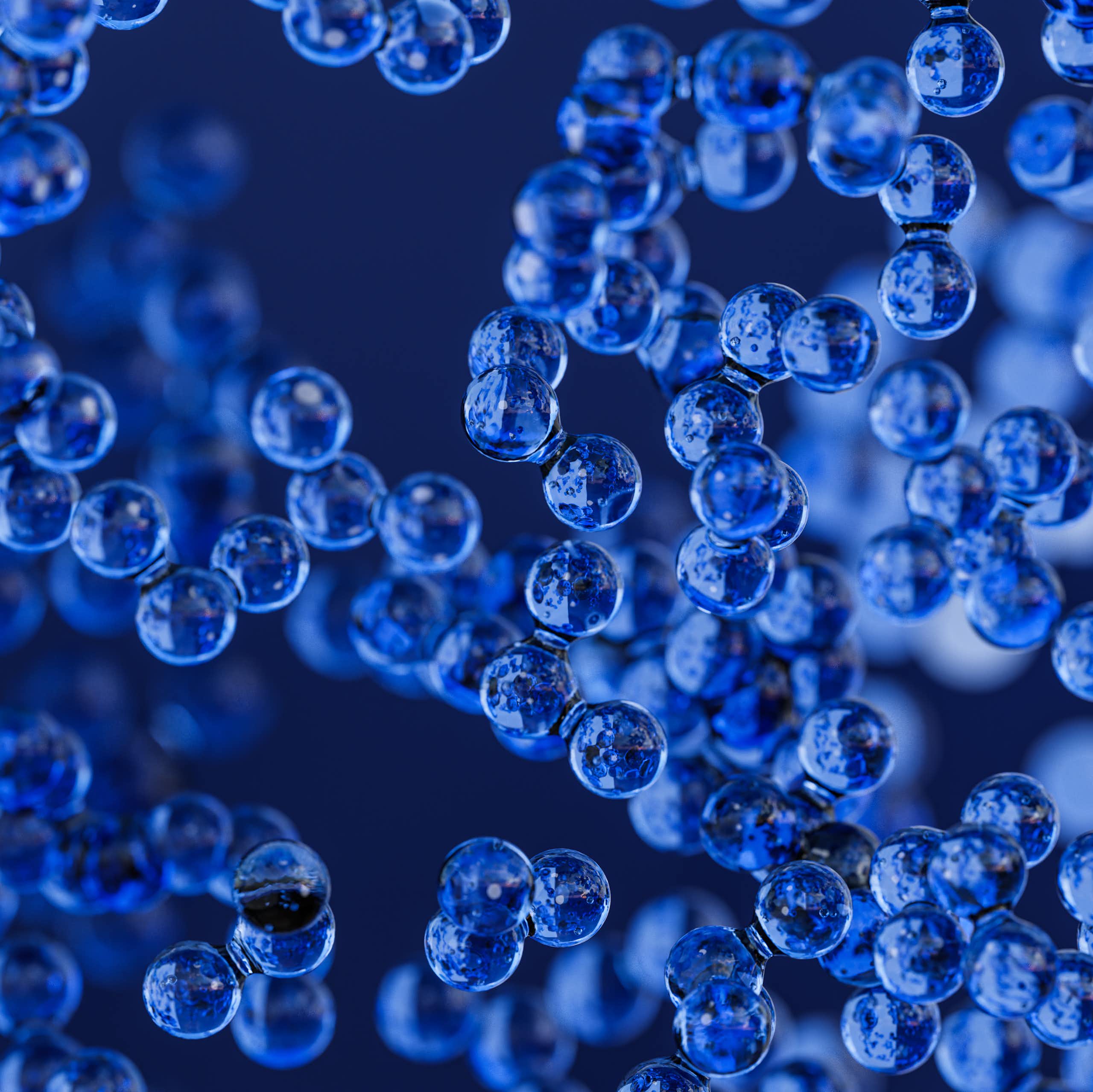An illustration of small blue spheres clustered together.
