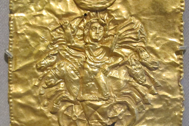 Section of gold jewelry showing a chariot