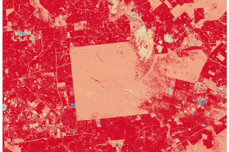 An animated image which shows an area of land transforming from blue-toned to red-toned.