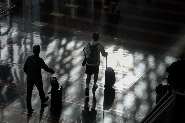 The silhouettes of people and luggage.