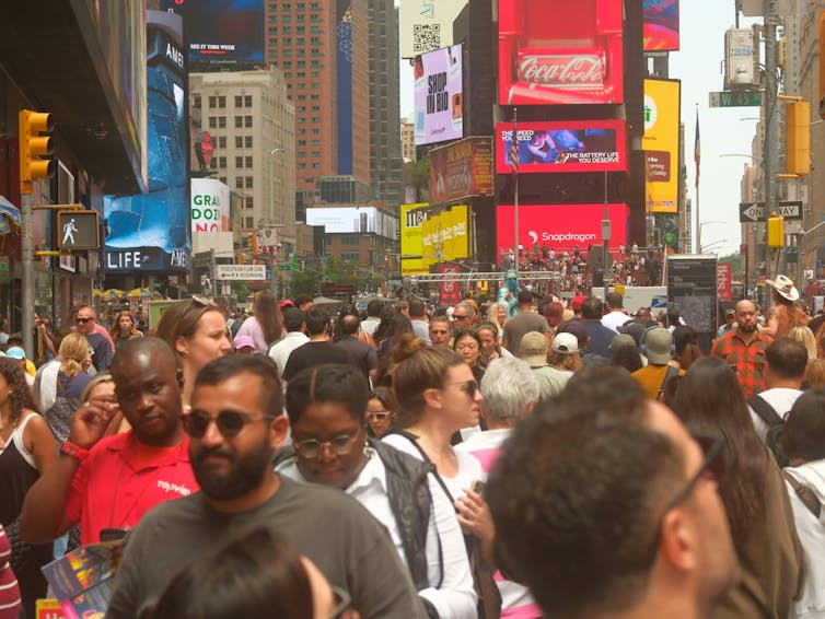 Pedestrians on a crowded street.