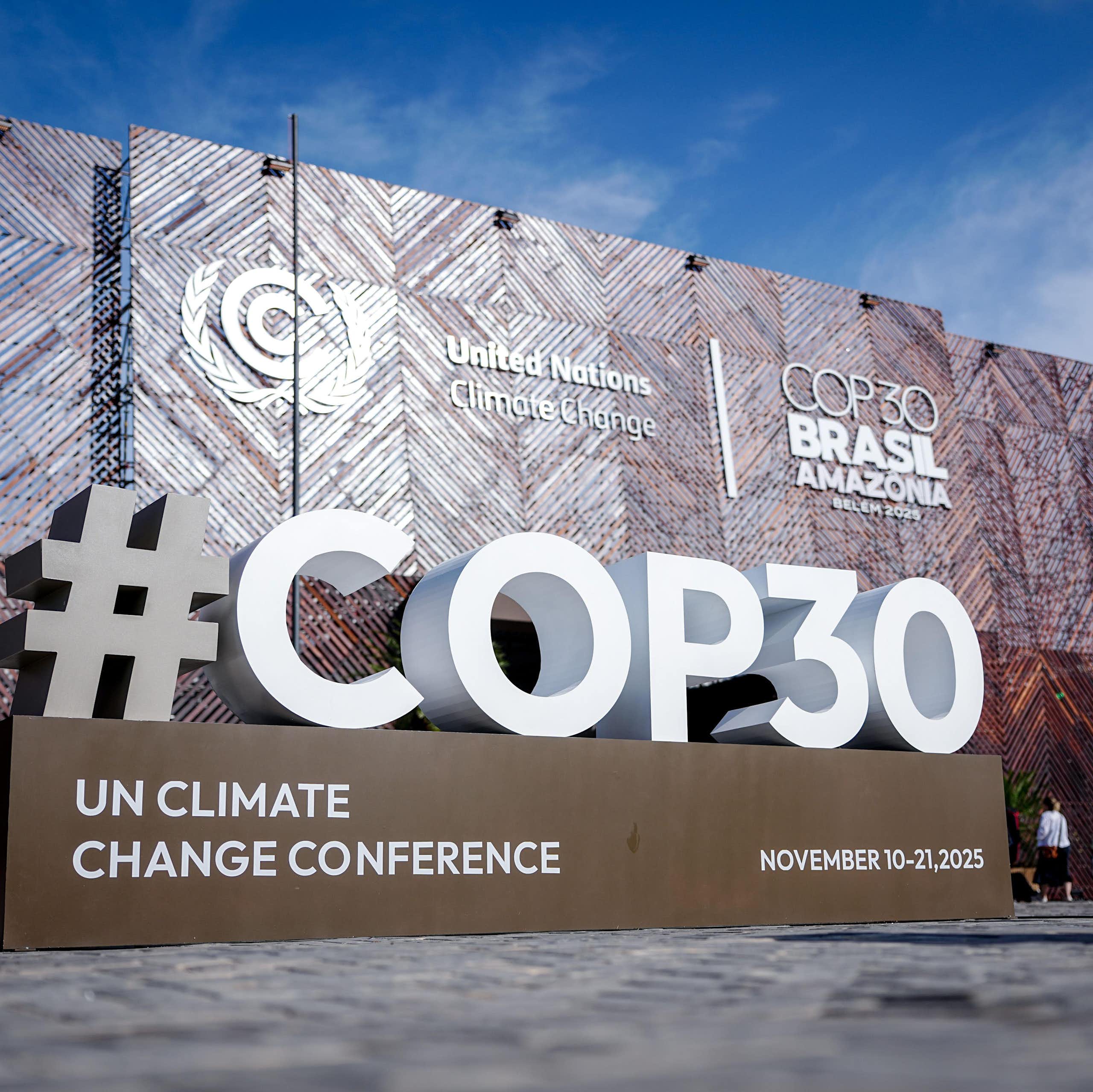 large '#cop30' sign outside building