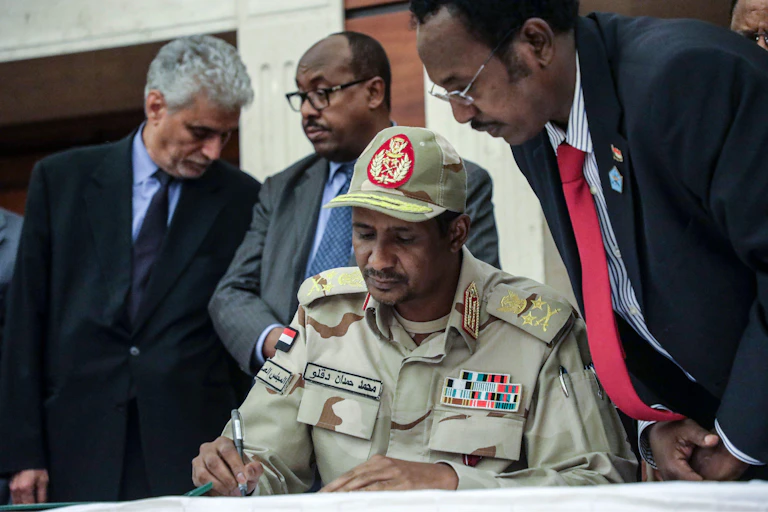 RSF leader, Mohammed Hamdan Dagalo, known as Hemedti, signs a power-sharing agrteement, 2019.