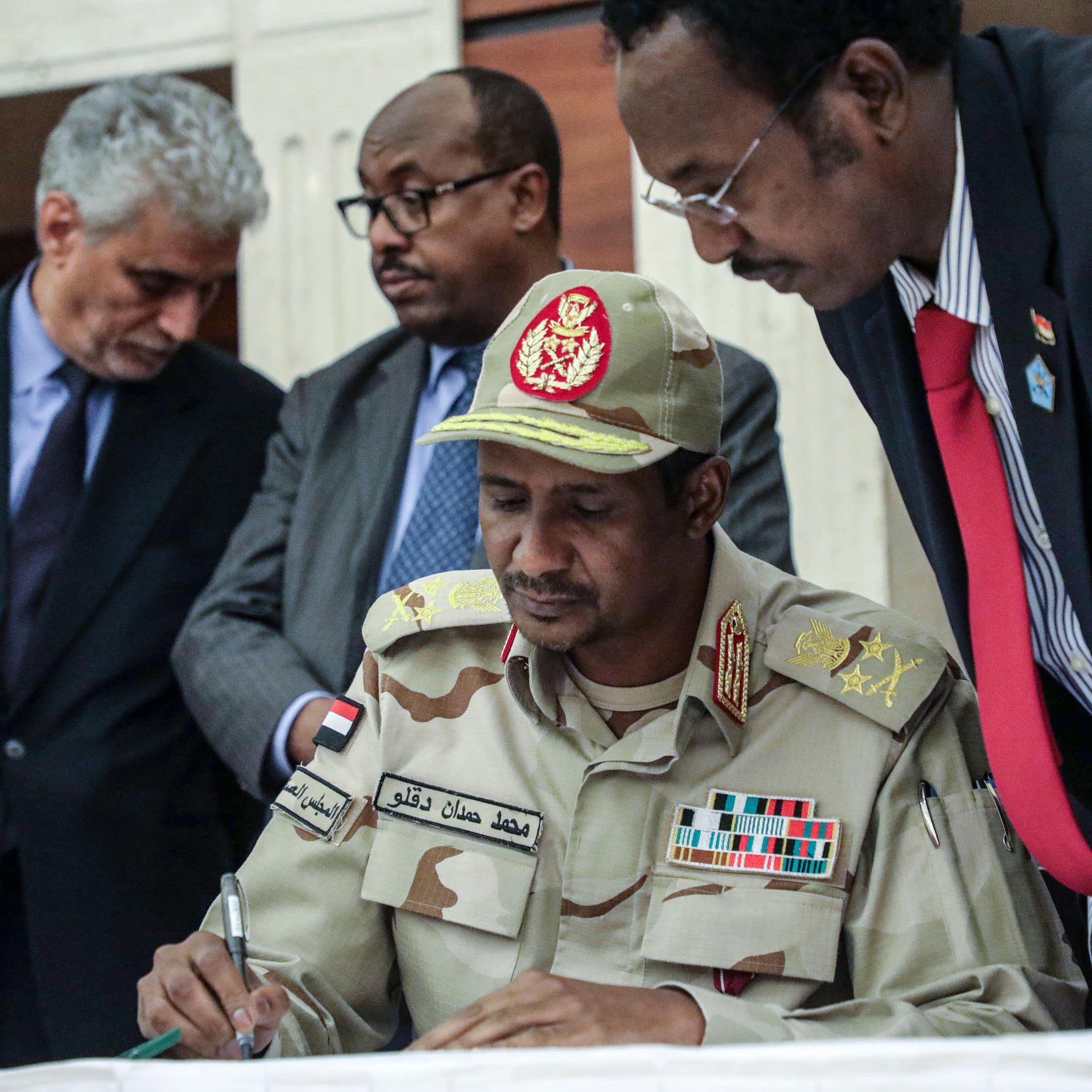 RSF leader, Mohammed Hamdan Dagalo, known as Hemedti, signs a power-sharing agrteement, 2019.