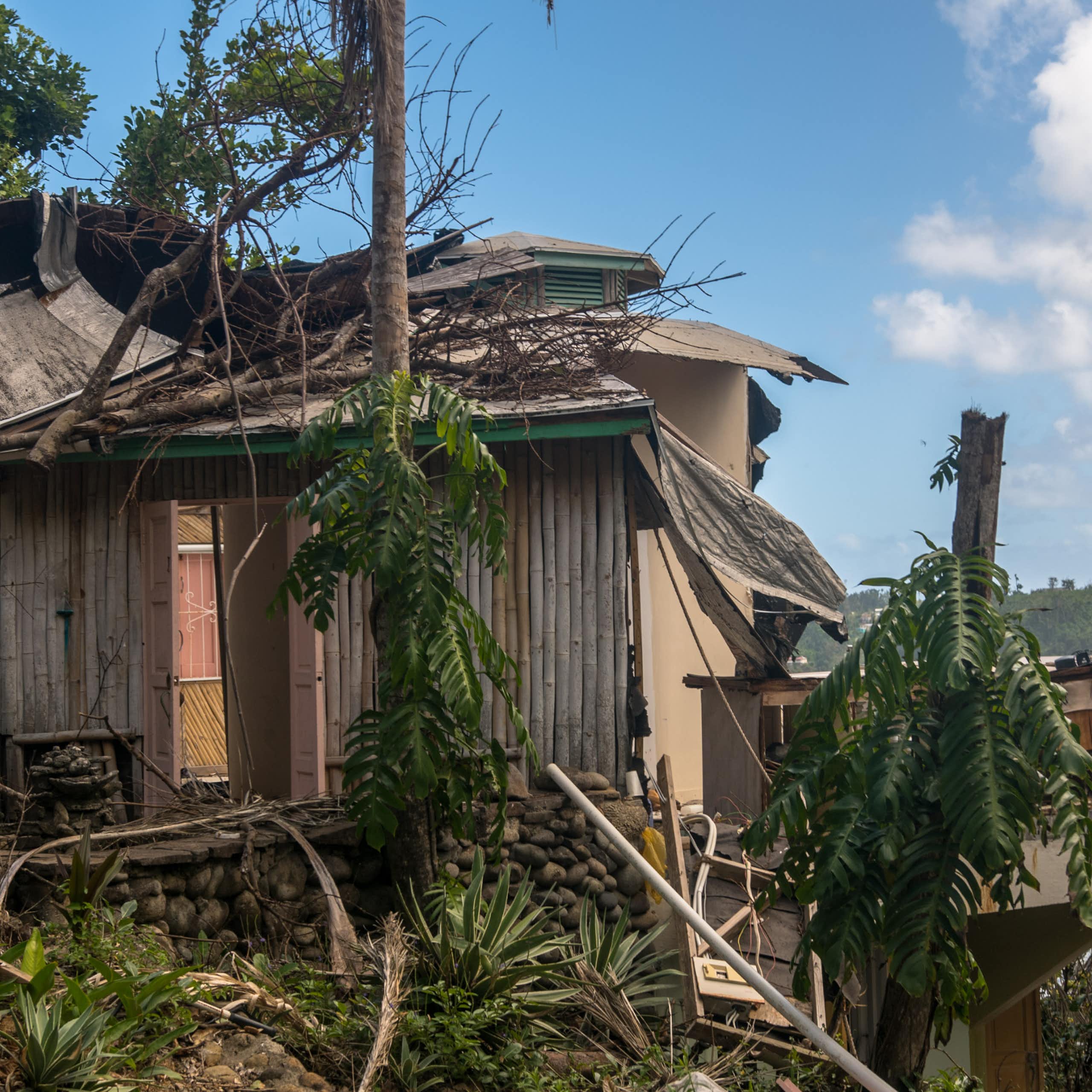 tropical island hurricane damage on buildings