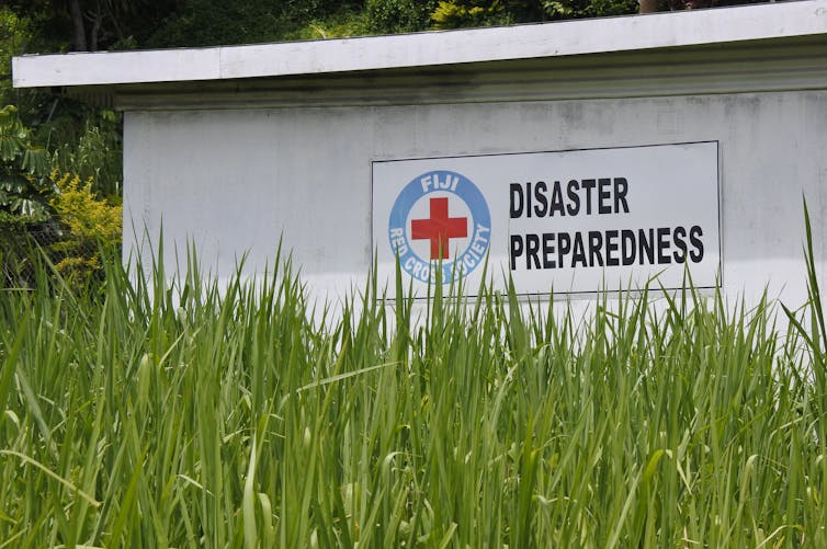 red cross white building with sign 'disaster preparedness'