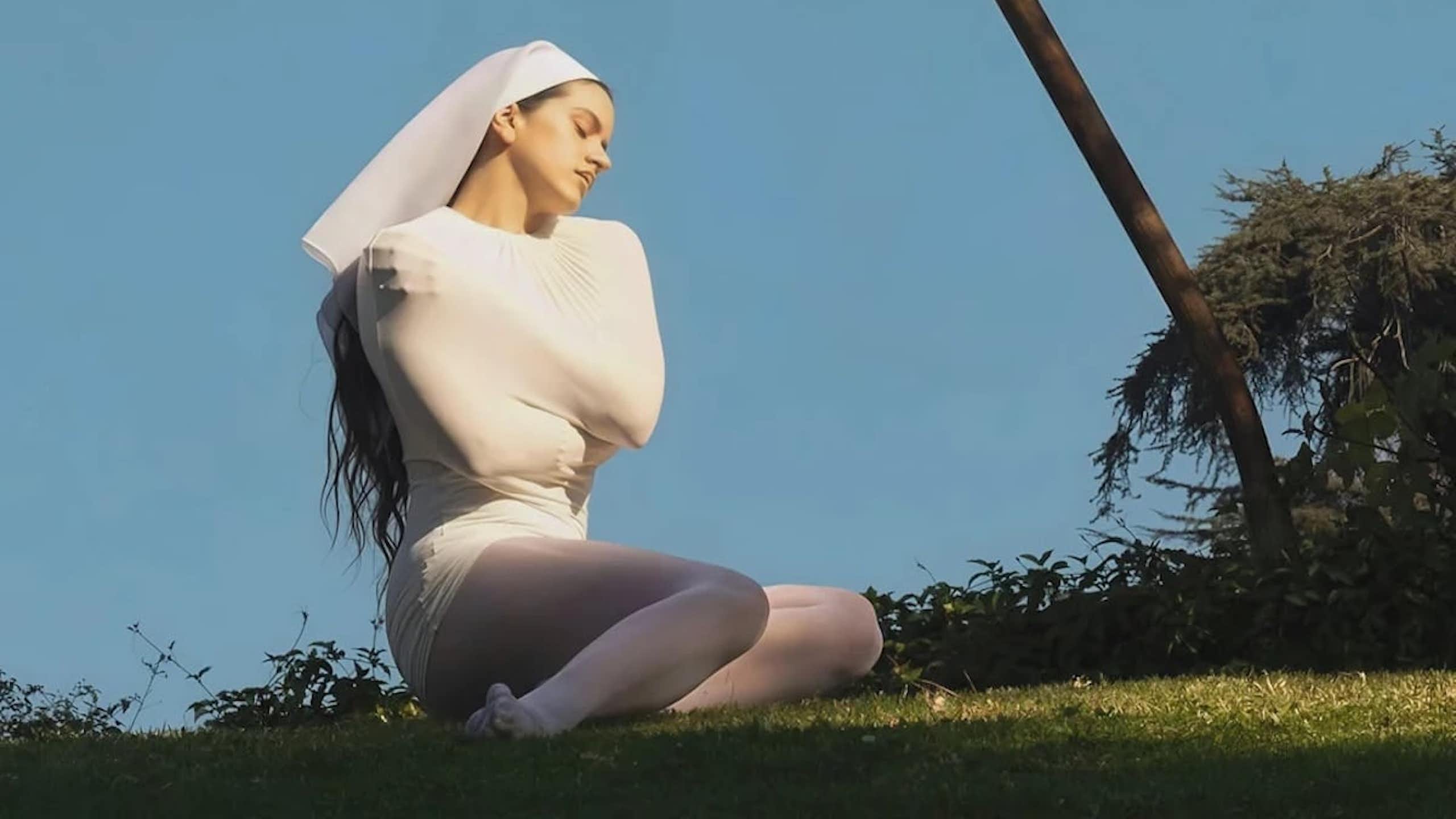 Rosalía in a costume that looks like a couture interpretation of a nun's habit