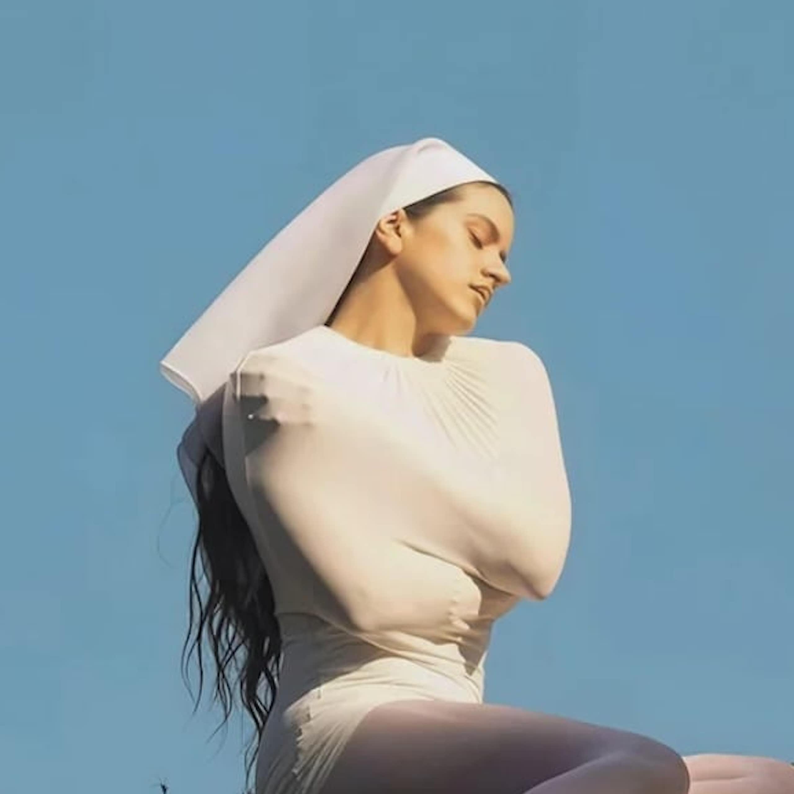 Rosalía in a costume that looks like a couture interpretation of a nun's habit