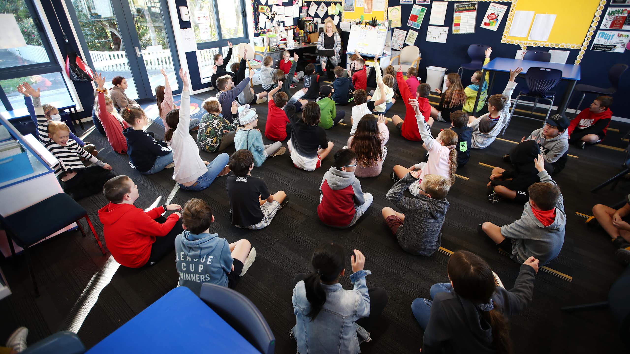 Teacher giving a lesson to a classroom of students