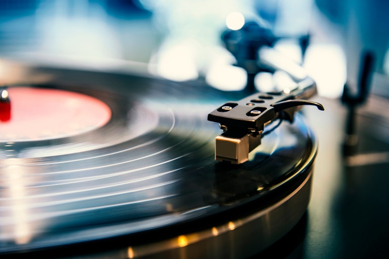 A vinyl record on a turntable.
