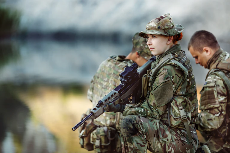 A group of three British soldiers take part in a training exercise.