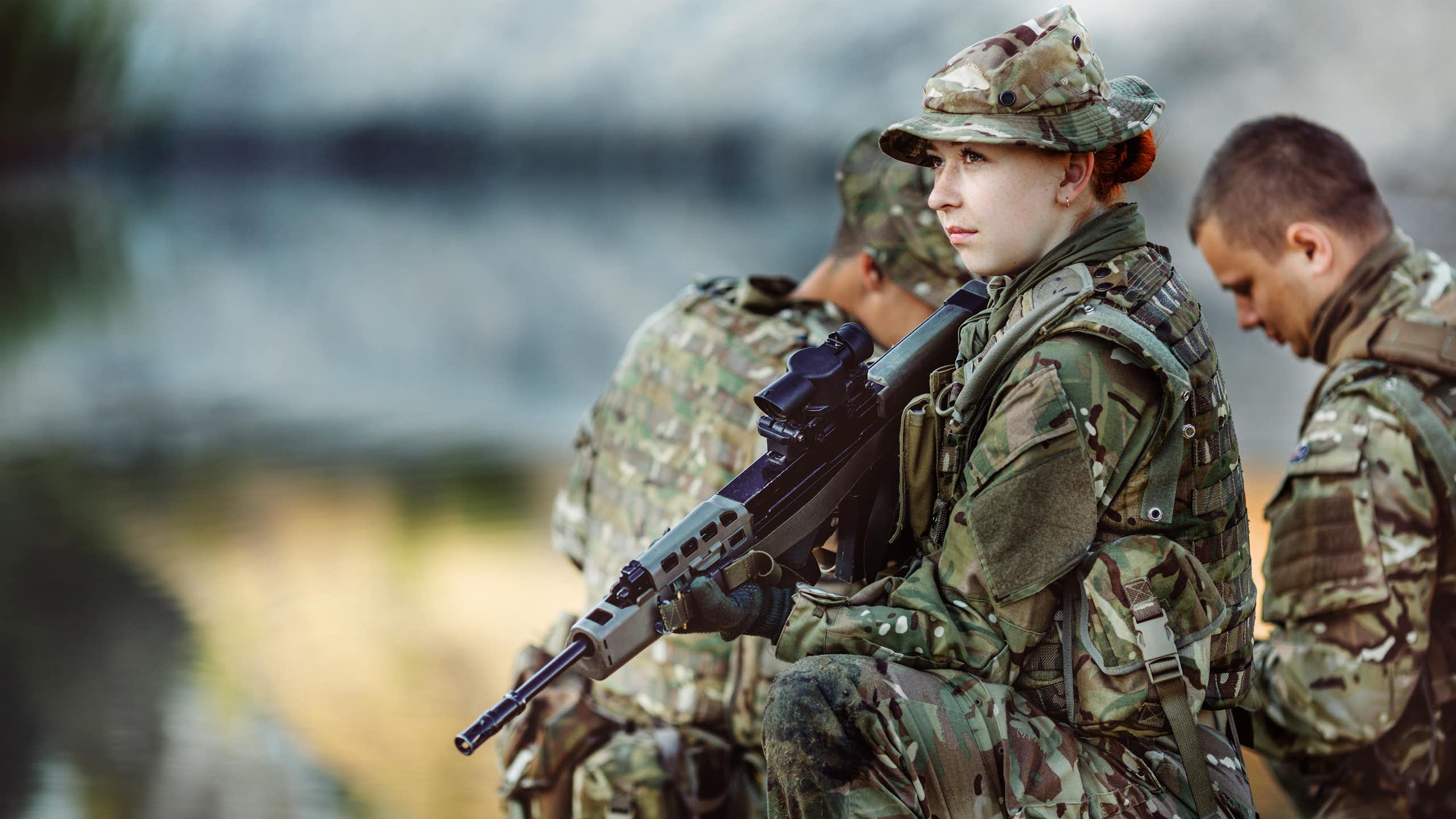 A group of three British soldiers take part in a training exercise.