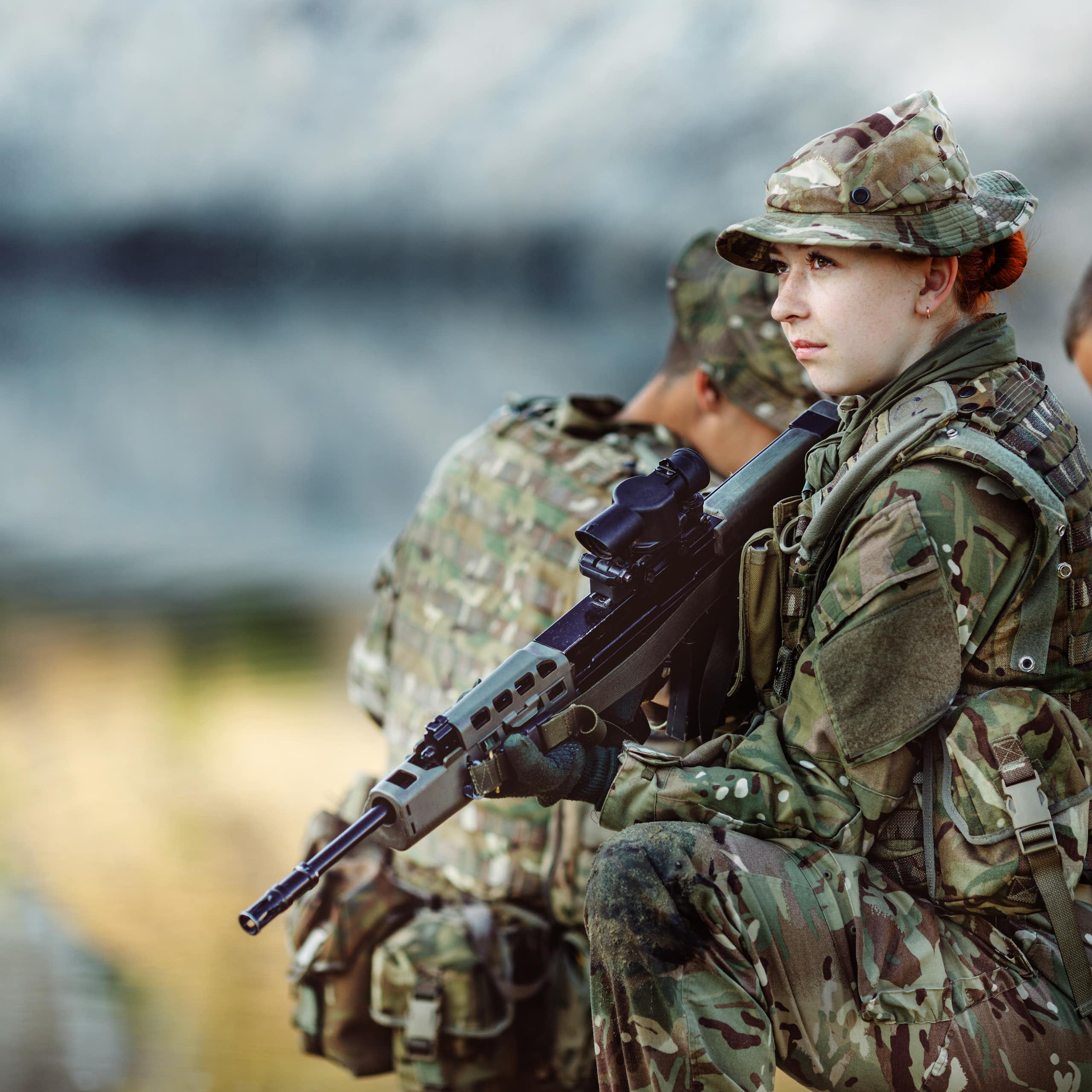 A group of three British soldiers take part in a training exercise.