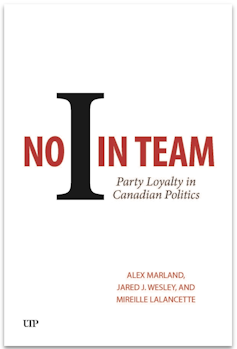A white book jacket cover that reads No I in Team.
