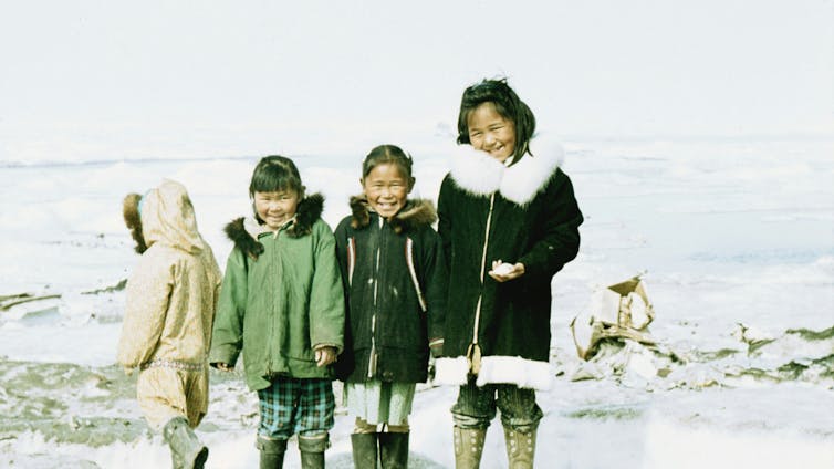 Four Inuit children.