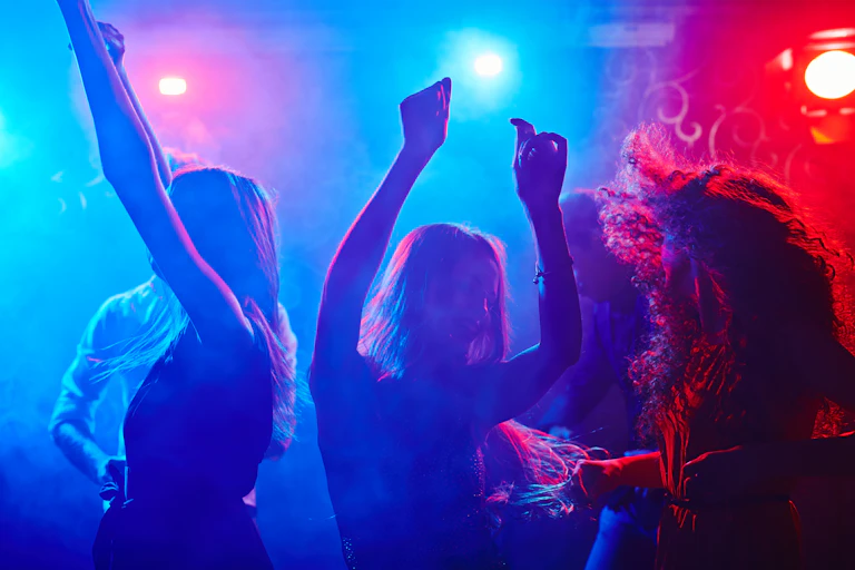 People dance in a nightclub