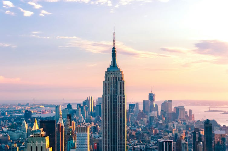 The Empire State building sits against the New York skyline.