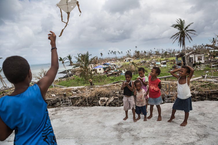 Why small climate-vulnerable island states punch neatly above their weight in UN weather talks 1 Children play in storm-damaged village