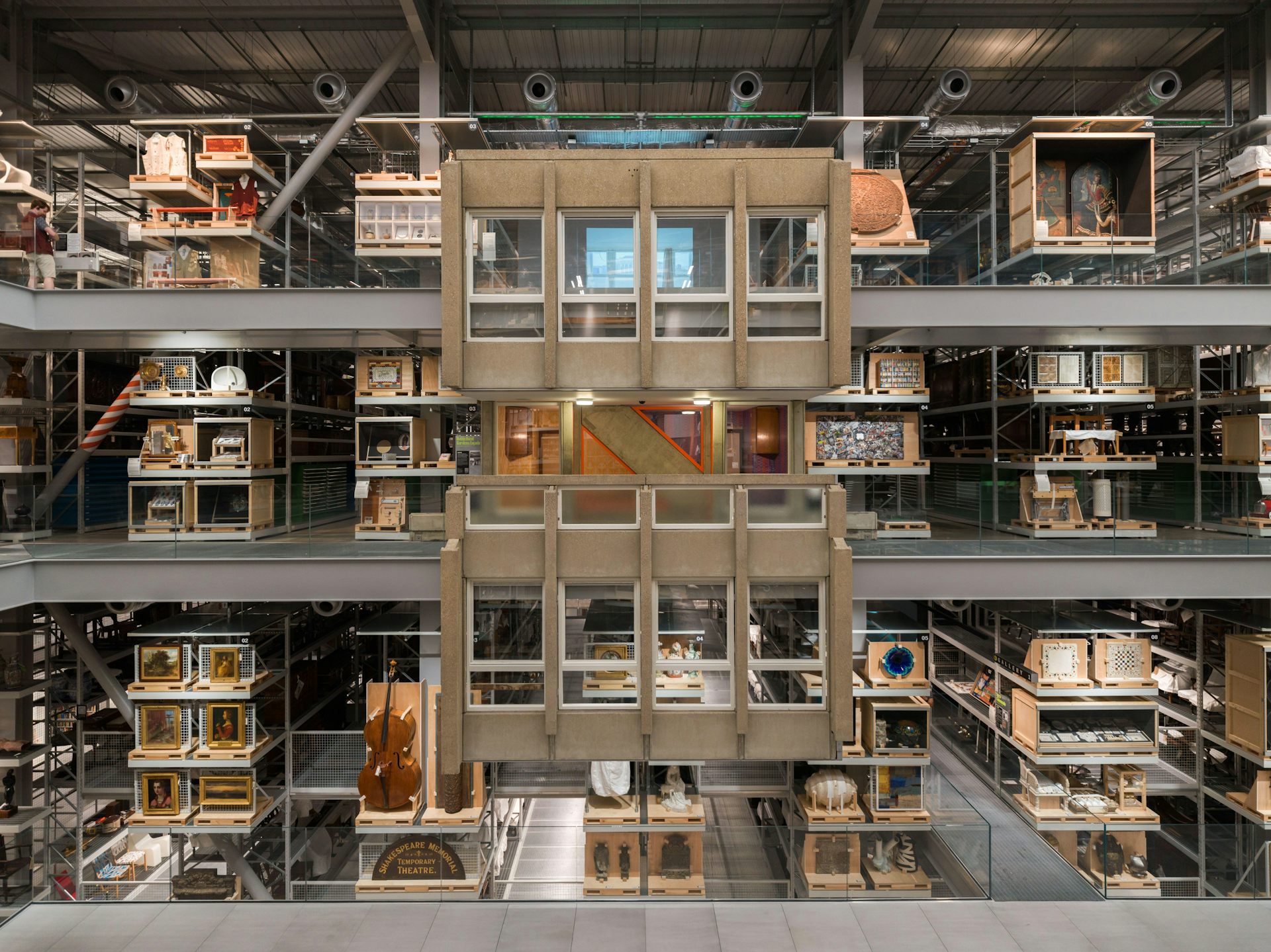The inside of a museum storage collection showing three floors like a doll's house with the front removed.