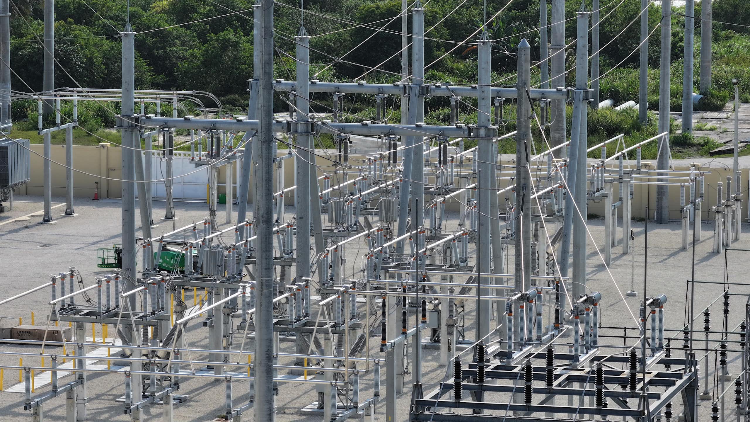 Wires, towers and equipment meet in a power-grid substation.